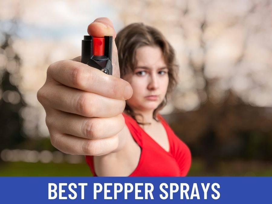 lady pointing a pepper spray