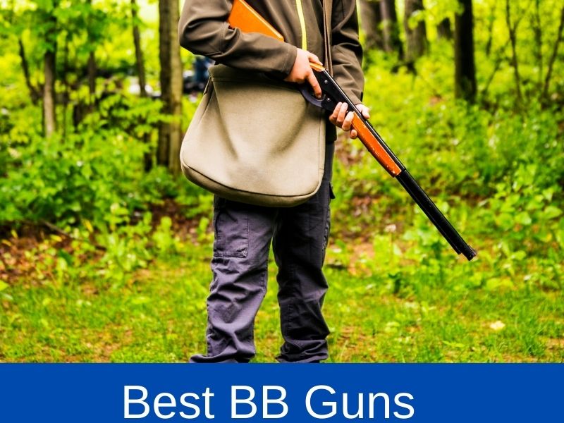 young boy holding a BB gun
