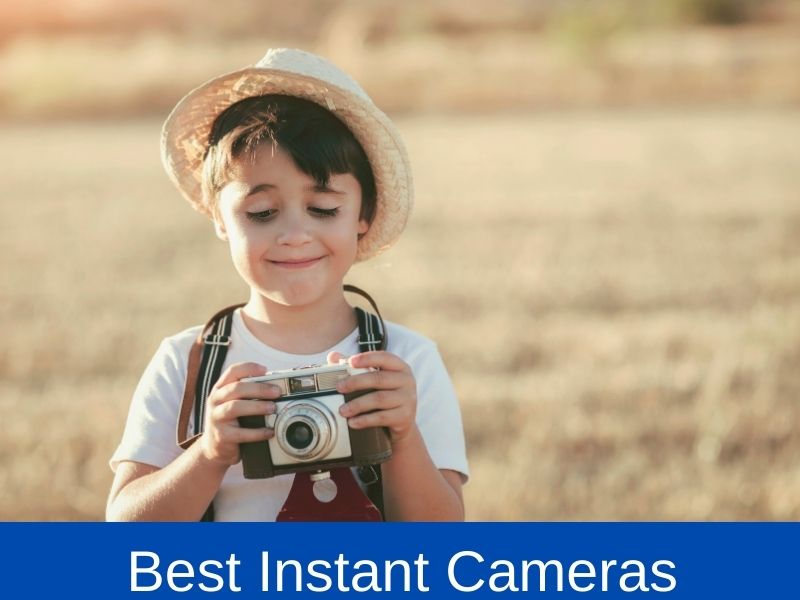 kid holding an instant camera