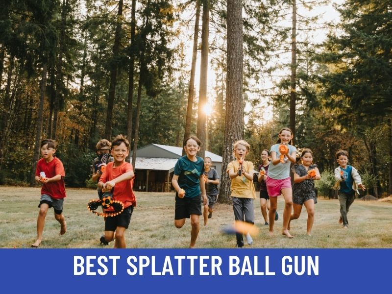 kids having fun holding splatter ball guns